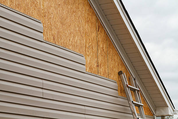 Professional Storm Damage Siding Repair technician working in Hydes, MD
